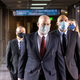 Former Minneapolis Police Officers J. Alexander Kueng (R) and Tou Thao (L) arrive with and attorney Thomas Plunkett (C) at the US District Court in St. Paul, Minnesota, on January 11, 2022, for the pre-trial of three former Minneapolis police officers charged with federal civil rights violations in George Floyd’s death.